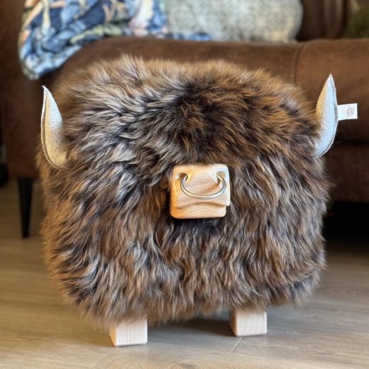 Highland Bull Footstool in Gingerbread with a Nose Ring Highland bull footstool in gingerbread with a nose ring